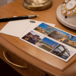 postcards, pencil on a desk