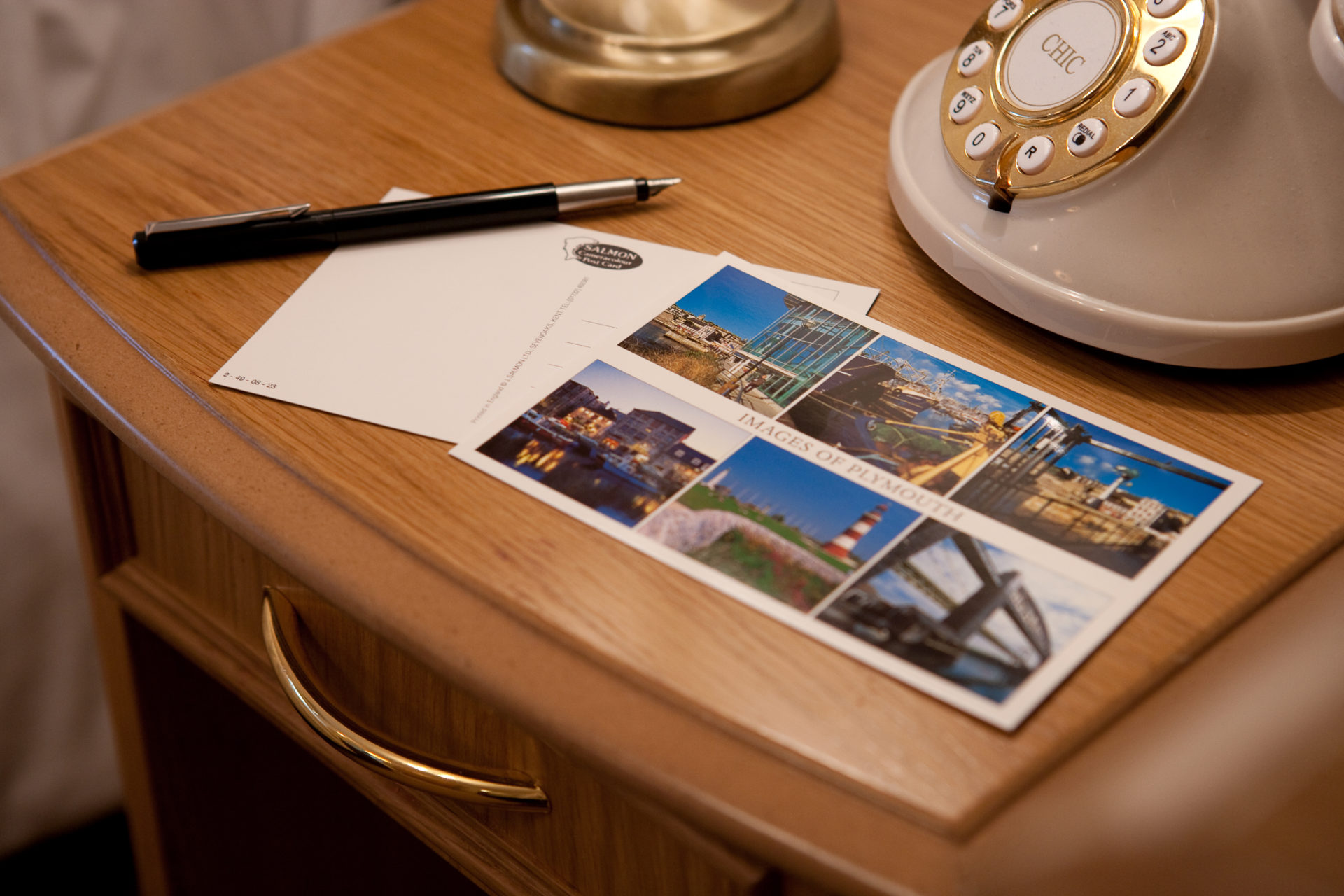 postcards, pencil on a desk