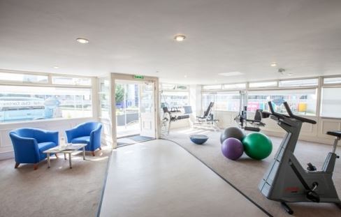 yoga and gym equipment in a room