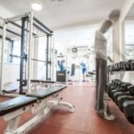 man stretching out in the gym