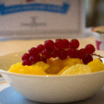 white bowl with fruit and berries