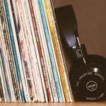 records leaned up together with headphones