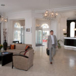 man walking in hotel reception with briefcase