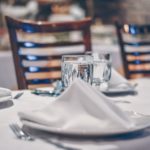 table set up with glasses and napkins