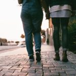 two people walking hand in hand