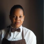 lady with an apron and bow tie waiting staff