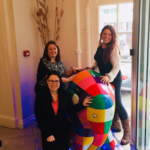 ELmer in hotel reception with staff