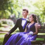boy and girl on bench before prom