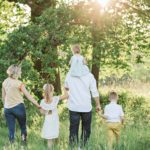 family enjoying a walk in the forest