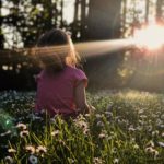 little girl in a field